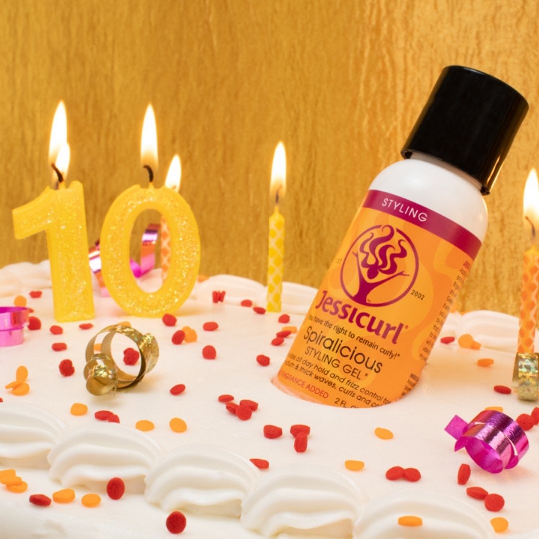 2 oz Spiralicious bottle in white cake with 10 candles and