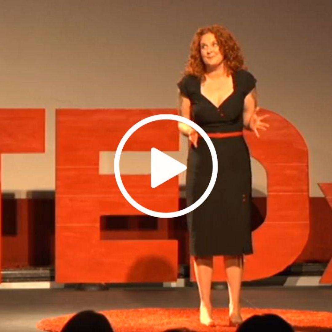 Jessicurl Founder Jessica McGuinty on stage, speaking at TEDx.