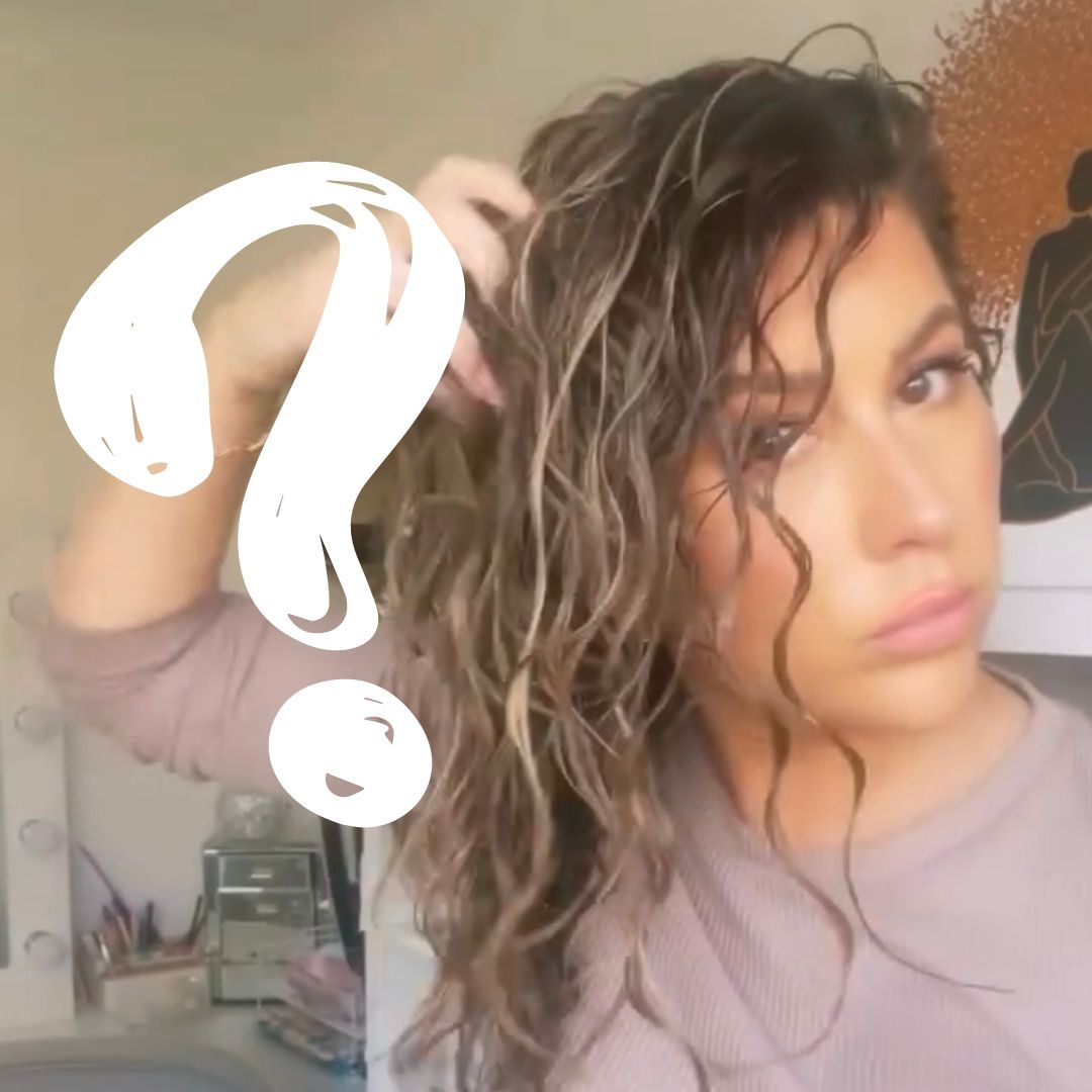 Chief Educator Claire displaying her wet hair showing the different curl types on her own head