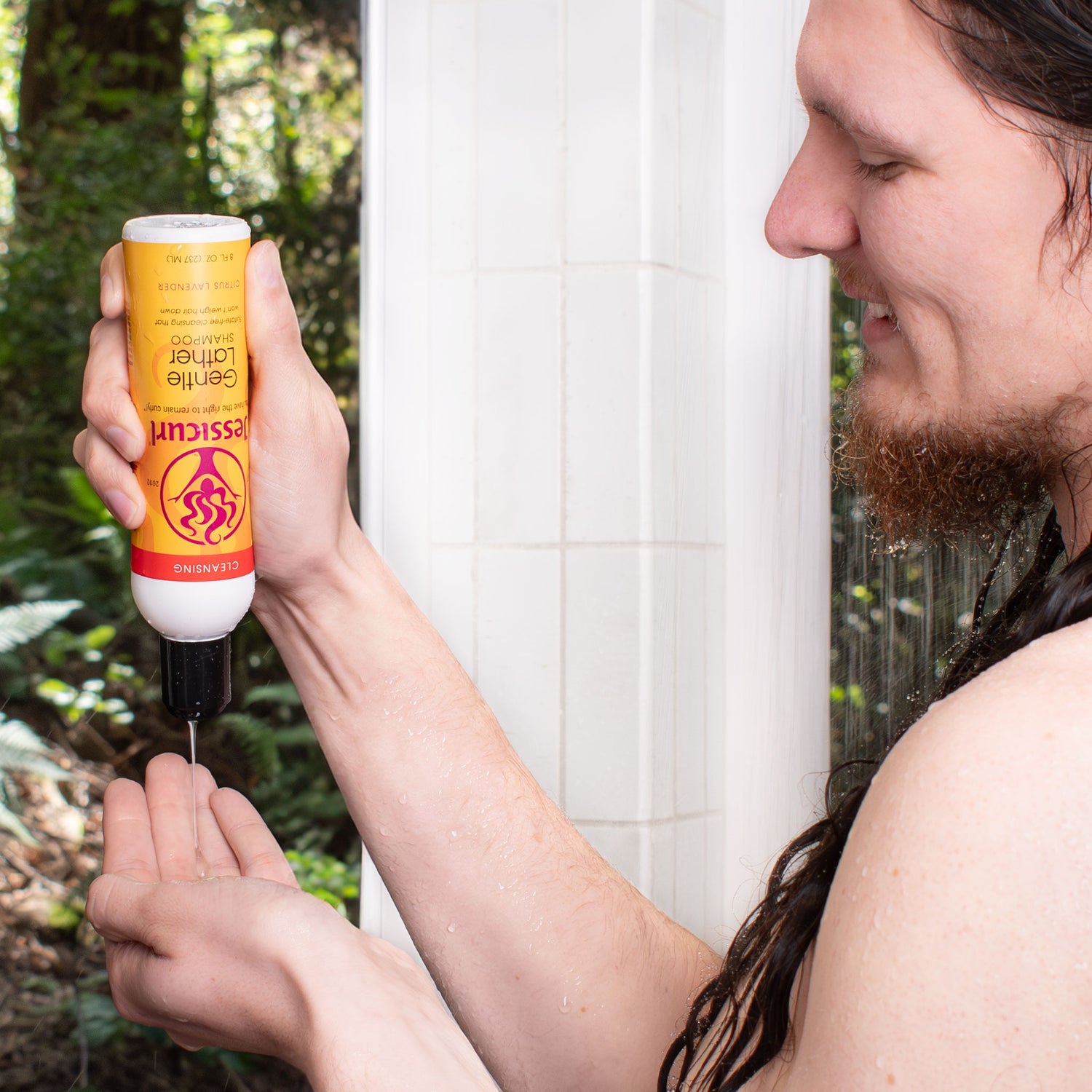 Man pouring Gentle Lather Shampoo into hand